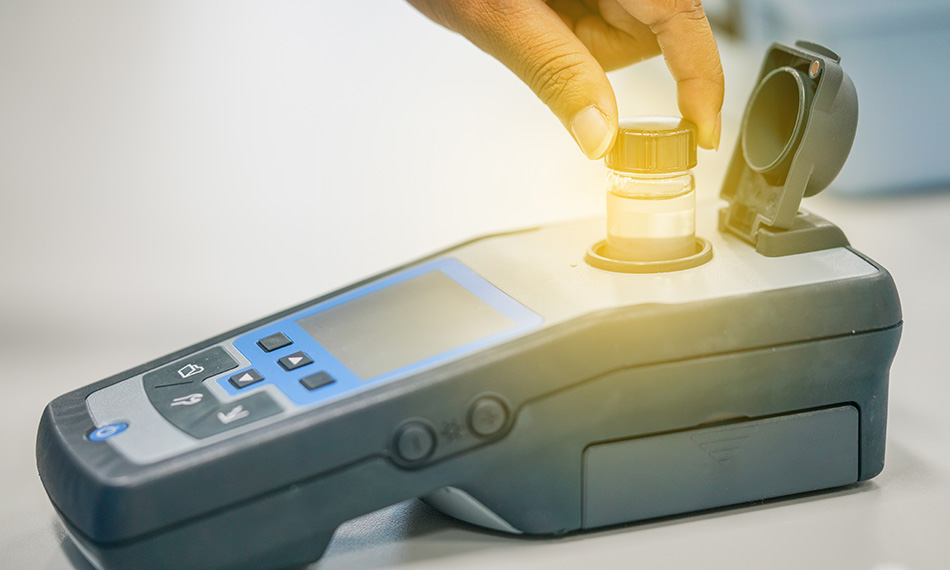 Scientist working at water quality test use by Spectrophotometer in the laboratory